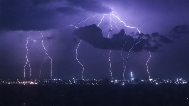 Lightning strikes over city