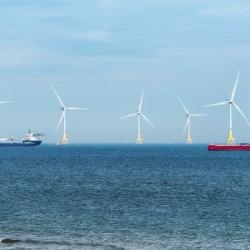 Windmills and ships in the sea